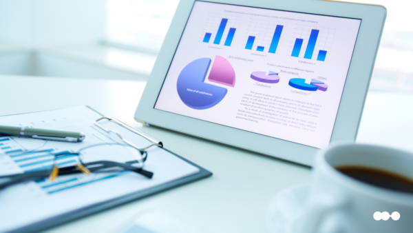 Tablet displaying charts and graphs used to compare financial reports across business units