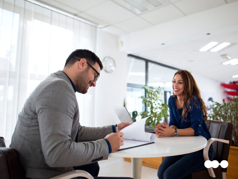 Manager and tenant reviewing onboarding documents in office