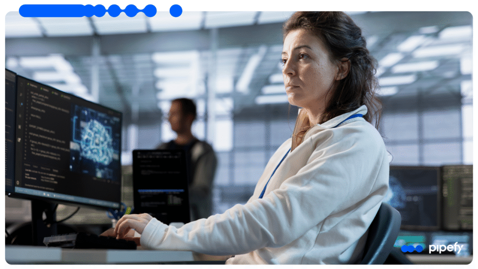 Profissional operando computador em ambiente corporativo com apoio de BYOLLM e Inteligência Artificial