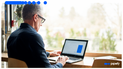 Executive reviewing performance data on laptop, symbolizing how smarter workflows help prevent CPG delays