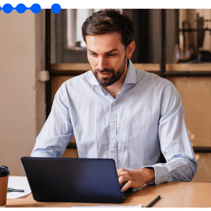 Business professional working on laptop representing RPA and task automation with Pipefy
