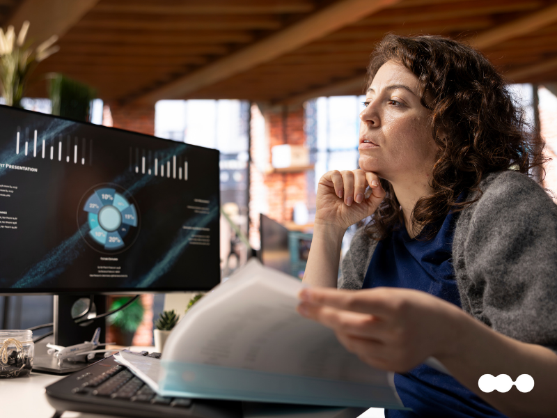 Analyst reviewing compliance reports supported by Agentic AI workflows