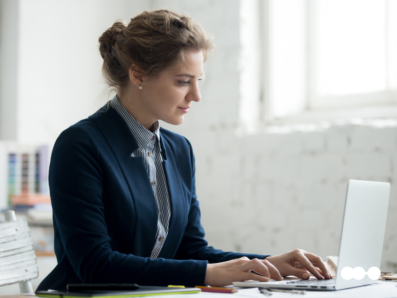 Professional working on laptop illustrating iPaaS benefits in workflow automation