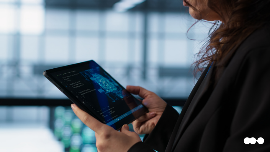 A business professional reviewing financial data on a tablet, illustrating the clarity provided by digital banking automation solutions.
